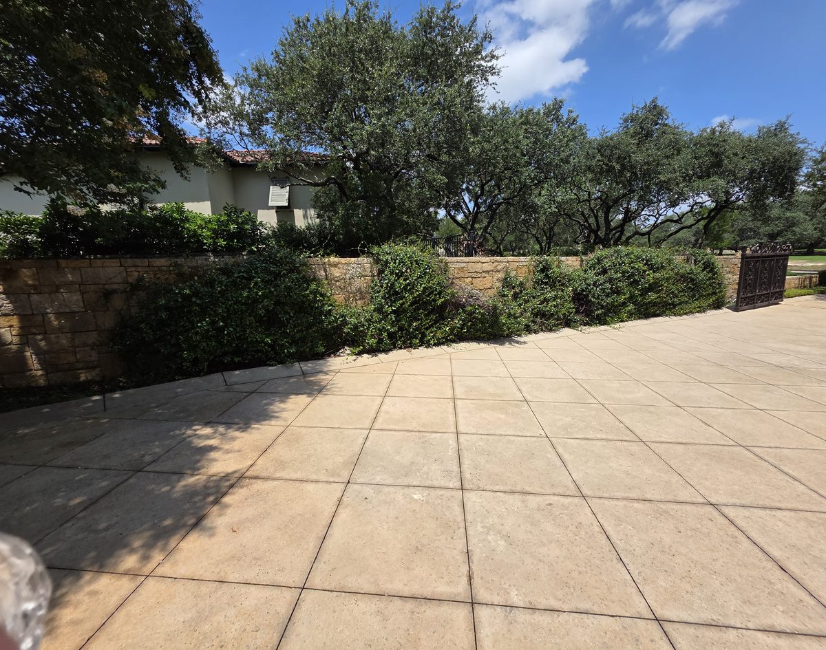 A stamped concrete driveway after washing