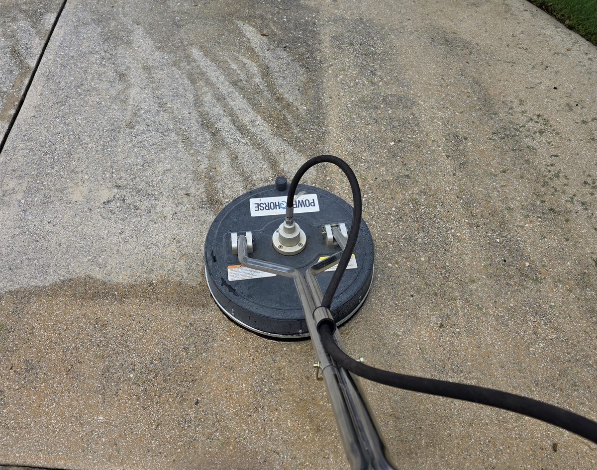 Surface cleaner leaving a clean line on concrete