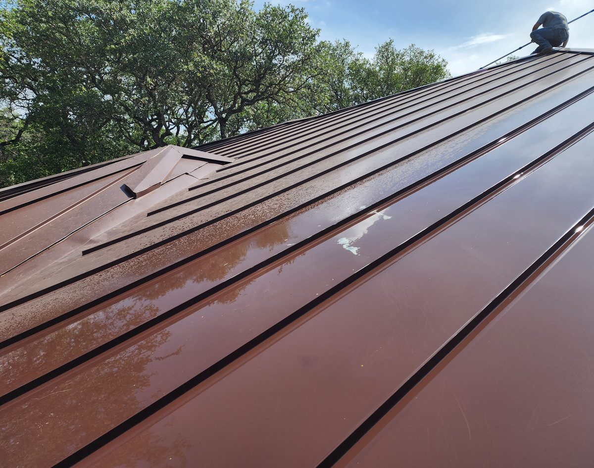 A wet standing-seam metal roof