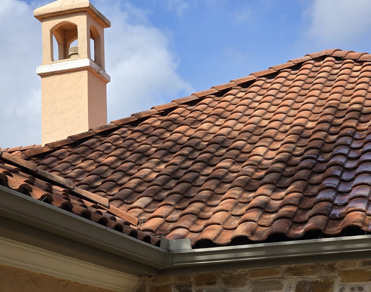Clay tile roof with a clean gutter line