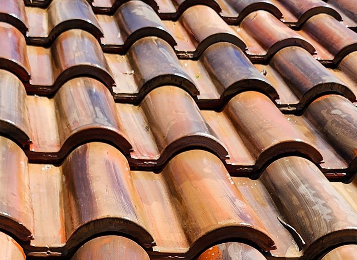 A clay tile roof after soft-wash cleaning