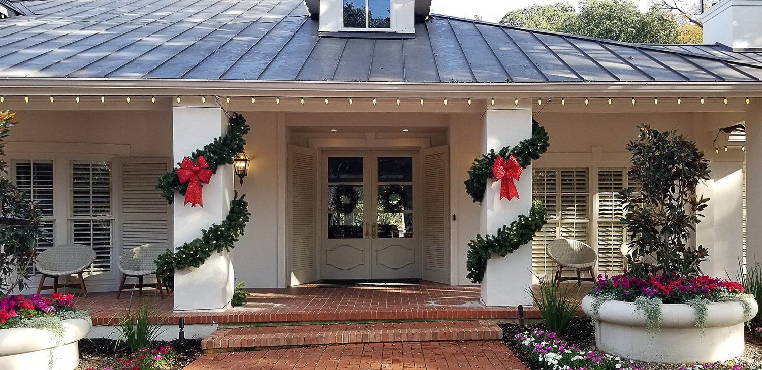 Garland and wreaths on a front entry